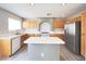 Modern kitchen with stainless steel appliances, island and plenty of cabinet space at 7371 Catmint St, Las Vegas, NV 89113