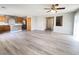 Bright living room with hard surface floors seamlessly connecting to the modern kitchen at 7371 Catmint St, Las Vegas, NV 89113