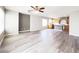Open-concept living room featuring hard surface floors, ceiling fan and lots of natural light at 7371 Catmint St, Las Vegas, NV 89113