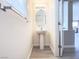 Stylish powder room with pedestal sink, modern fixtures, and tiled flooring at 7371 Catmint St, Las Vegas, NV 89113