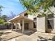 Spacious backyard features a covered patio, perfect for outdoor lounging and entertaining at 7900 Wood Shadow Ct, Las Vegas, NV 89131