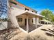 Backyard with covered patio providing shade and space for outdoor entertaining at 7900 Wood Shadow Ct, Las Vegas, NV 89131
