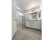 Bathroom with double vanity, shower, and tiled floors at 7900 Wood Shadow Ct, Las Vegas, NV 89131