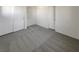 This bedroom provides ample storage, offering three large closets and neutral carpeting at 7900 Wood Shadow Ct, Las Vegas, NV 89131