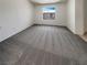 Carpeted bedroom with a window providing natural light at 7900 Wood Shadow Ct, Las Vegas, NV 89131