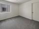 Cozy bedroom with plush carpet and a sunny window at 7900 Wood Shadow Ct, Las Vegas, NV 89131