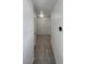 Hallway with neutral carpeting provides access to other rooms within the home at 7900 Wood Shadow Ct, Las Vegas, NV 89131