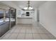 Eat-in kitchen featuring white cabinetry, modern appliances, and sliding door access to outdoor space at 7900 Wood Shadow Ct, Las Vegas, NV 89131