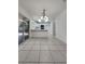 Bright eat-in kitchen featuring white cabinetry, modern appliances, and sliding door access to outdoor space at 7900 Wood Shadow Ct, Las Vegas, NV 89131