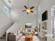 Staged living room featuring high ceilings, large windows, neutral decor, and comfortable seating area at 7900 Wood Shadow Ct, Las Vegas, NV 89131