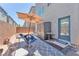 Enjoy the private backyard patio with outdoor seating, umbrella and storage shed at 8076 Haywood Estate Ave, Las Vegas, NV 89113