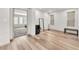 Large bedroom with wood floors, two large windows, and plenty of room for activities at 8076 Haywood Estate Ave, Las Vegas, NV 89113