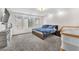 Bedroom with a comfortable bed, neutral-toned carpet, and an entertainment center with storage, offering a relaxing retreat at 8076 Haywood Estate Ave, Las Vegas, NV 89113