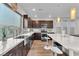 Bright kitchen with stainless steel appliances, island with breakfast bar, and ample counter space at 8076 Haywood Estate Ave, Las Vegas, NV 89113