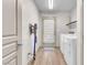 Laundry room with washer, dryer, vacuum cleaner and access to the backyard at 8076 Haywood Estate Ave, Las Vegas, NV 89113