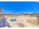 Spacious dirt backyard with chain-link fencing, potential for landscaping, and a small blue pool at 844 Balzar Ave, Las Vegas, NV 89106