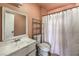 Bathroom featuring a vanity, toilet, and shower with curtain at 844 Balzar Ave, Las Vegas, NV 89106