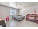 Bedroom featuring neutral walls, a bed frame, and a crib at 844 Balzar Ave, Las Vegas, NV 89106