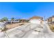 Single-story home with a concrete driveway, minimal landscaping, and an attached two-car garage at 844 Balzar Ave, Las Vegas, NV 89106