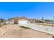 Single-story home featuring a concrete driveway leading to an attached two-car garage, complemented by minimal landscaping at 844 Balzar Ave, Las Vegas, NV 89106