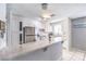 Bright kitchen with stainless steel appliances, white cabinets, and breakfast bar at 844 Balzar Ave, Las Vegas, NV 89106
