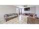 Cozy living room featuring neutral paint, tile flooring, and comfortable seating with a TV for entertainment at 844 Balzar Ave, Las Vegas, NV 89106