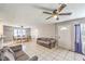 Bright living space featuring tile floors, an open layout, and access to the dining area and front door at 844 Balzar Ave, Las Vegas, NV 89106