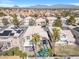 Expansive aerial view of a home with a backyard pool and patio in a residential neighborhood at 9417 Grenville Ave, Las Vegas, NV 89134