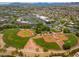 Aerial view of community baseball fields with well-maintained green grass and groomed red dirt at 9417 Grenville Ave, Las Vegas, NV 89134
