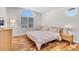 Bright bedroom with large window, hardwood floors, and neutral decor at 9417 Grenville Ave, Las Vegas, NV 89134
