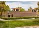 The Trails Community Center, featuring an attractive brick facade, well-kept grounds, and surrounding foliage at 9417 Grenville Ave, Las Vegas, NV 89134