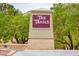 Community entrance sign to The Trails, a village at Summerlin, with mature landscaping at 9417 Grenville Ave, Las Vegas, NV 89134