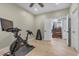 Bright exercise room with workout equipment and an open staircase at 9417 Grenville Ave, Las Vegas, NV 89134