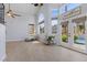 Bright living room with high ceilings, tile flooring, and natural light and access to the pool at 9417 Grenville Ave, Las Vegas, NV 89134
