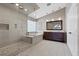 Modern main bathroom with glass enclosed shower, soaking tub, and double vanity at 9417 Grenville Ave, Las Vegas, NV 89134