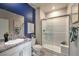 This stylish bathroom features granite counters and a walk-in shower at 1044 Forest Falcon Dr, Henderson, NV 89011