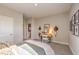 Comfortable bedroom with carpet, desk, and view to bathroom at 1044 Forest Falcon Dr, Henderson, NV 89011