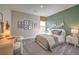Cozy bedroom features neutral walls, carpeted floor, and natural light at 1044 Forest Falcon Dr, Henderson, NV 89011
