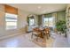 Elegant dining area with stylish decor, natural light, and modern furnishings at 1044 Forest Falcon Dr, Henderson, NV 89011