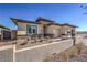 Single-story home featuring stucco siding and desert landscaping at 1044 Forest Falcon Dr, Henderson, NV 89011