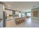 Bright kitchen with granite counters, stainless steel appliances, large island and modern cabinetry at 1044 Forest Falcon Dr, Henderson, NV 89011