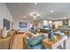 Bright and airy living area seamlessly connected to the kitchen with modern decor at 1044 Forest Falcon Dr, Henderson, NV 89011