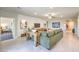 Stylish living room with tile floors that opens up to other rooms in the home at 1044 Forest Falcon Dr, Henderson, NV 89011