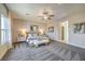 Expansive main bedroom featuring stylish decor, large windows, and contemporary design at 1044 Forest Falcon Dr, Henderson, NV 89011