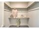 This walk-in closet features neutral walls, carpeted floor, and shelving at 1044 Forest Falcon Dr, Henderson, NV 89011