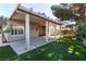 Spacious covered back patio with concrete flooring, offering an ideal outdoor living and entertaining space at 1409 Basin Brook Dr, North Las Vegas, NV 89032