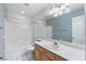 Bright bathroom featuring a bathtub/shower, single vanity and neutral accents at 1409 Basin Brook Dr, North Las Vegas, NV 89032