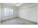 Neutral bedroom with shuttered windows and carpet flooring at 1409 Basin Brook Dr, North Las Vegas, NV 89032