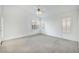 Spacious bedroom featuring vaulted ceiling, neutral carpet and bright, shuttered windows at 1409 Basin Brook Dr, North Las Vegas, NV 89032