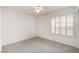 Neutral bedroom with shuttered windows and carpet flooring at 1409 Basin Brook Dr, North Las Vegas, NV 89032